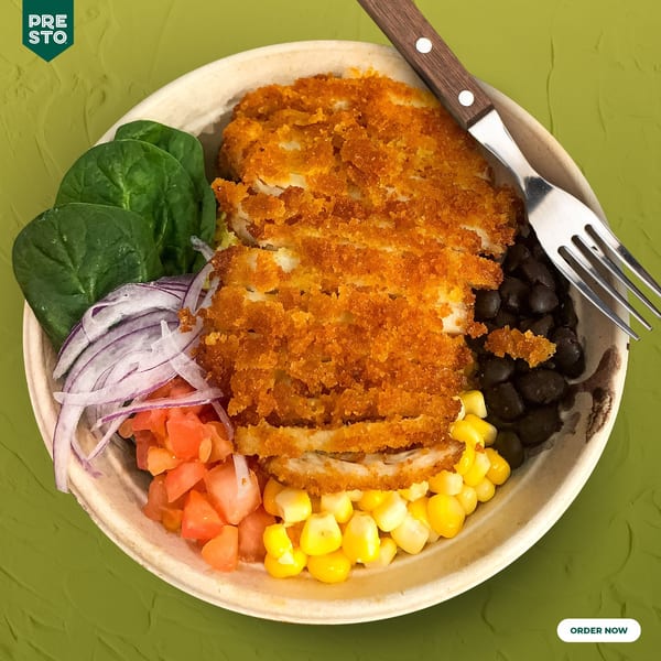 PRESTO FRESH CAFE's Mexican bowl with crispy chicken, spinach, red onion, tomatoes, corn, and black beans.